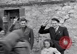 Image of 1st Infantry march past church of Sainte Marie du Mont Sainte Marie du Mont France, 1944, second 42 stock footage video 65675038186