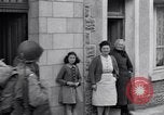 Image of 1st Infantry march past church of Sainte Marie du Mont Sainte Marie du Mont France, 1944, second 47 stock footage video 65675038186