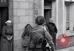 Image of 1st Infantry march past church of Sainte Marie du Mont Sainte Marie du Mont France, 1944, second 50 stock footage video 65675038186