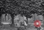 Image of 1st Infantry march past church of Sainte Marie du Mont Sainte Marie du Mont France, 1944, second 56 stock footage video 65675038186