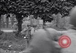 Image of 1st Infantry march past church of Sainte Marie du Mont Sainte Marie du Mont France, 1944, second 58 stock footage video 65675038186