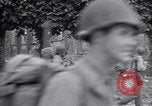Image of 1st Infantry march past church of Sainte Marie du Mont Sainte Marie du Mont France, 1944, second 59 stock footage video 65675038186