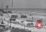 Image of Equipment and reinforcements landing in invasion of France Normandy France, 1944, second 38 stock footage video 65675038225