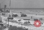 Image of Equipment and reinforcements landing in invasion of France Normandy France, 1944, second 42 stock footage video 65675038225