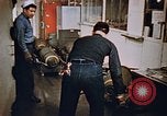 Image of bomb loading on USS Boxer Korea, 1953, second 60 stock footage video 65675038545