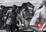 Image of rescued prisoners eating soup Luzon Island Philippines, 1945, second 33 stock footage video 65675038671
