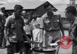 Image of rescued prisoners eating soup Luzon Island Philippines, 1945, second 34 stock footage video 65675038671