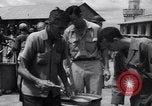 Image of rescued prisoners eating soup Luzon Island Philippines, 1945, second 36 stock footage video 65675038671