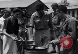 Image of rescued prisoners eating soup Luzon Island Philippines, 1945, second 49 stock footage video 65675038671
