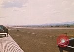Image of long line of UH-1 Helicopters Pleiku Vietnam, 1970, second 5 stock footage video 65675038743