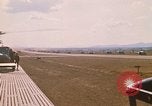 Image of long line of UH-1 Helicopters Pleiku Vietnam, 1970, second 6 stock footage video 65675038743