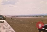 Image of long line of UH-1 Helicopters Pleiku Vietnam, 1970, second 7 stock footage video 65675038743