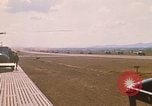 Image of long line of UH-1 Helicopters Pleiku Vietnam, 1970, second 8 stock footage video 65675038743