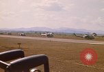 Image of long line of UH-1 Helicopters Pleiku Vietnam, 1970, second 13 stock footage video 65675038743
