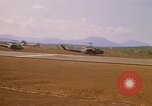 Image of long line of UH-1 Helicopters Pleiku Vietnam, 1970, second 15 stock footage video 65675038743