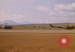 Image of long line of UH-1 Helicopters Pleiku Vietnam, 1970, second 16 stock footage video 65675038743
