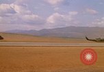Image of long line of UH-1 Helicopters Pleiku Vietnam, 1970, second 18 stock footage video 65675038743