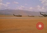 Image of long line of UH-1 Helicopters Pleiku Vietnam, 1970, second 19 stock footage video 65675038743