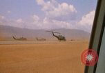 Image of long line of UH-1 Helicopters Pleiku Vietnam, 1970, second 21 stock footage video 65675038743