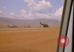 Image of long line of UH-1 Helicopters Pleiku Vietnam, 1970, second 22 stock footage video 65675038743