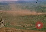 Image of long line of UH-1 Helicopters Pleiku Vietnam, 1970, second 24 stock footage video 65675038743