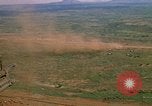 Image of long line of UH-1 Helicopters Pleiku Vietnam, 1970, second 25 stock footage video 65675038743