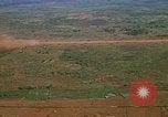 Image of long line of UH-1 Helicopters Pleiku Vietnam, 1970, second 30 stock footage video 65675038743