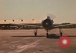 Image of Laotian trainer aircraft T-28D Udorn Royal Thai Air Force Base Thailand, 1972, second 4 stock footage video 65675038807