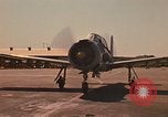 Image of Laotian trainer aircraft T-28D Udorn Royal Thai Air Force Base Thailand, 1972, second 10 stock footage video 65675038807
