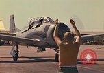 Image of Laotian trainer aircraft T-28D Udorn Royal Thai Air Force Base Thailand, 1972, second 31 stock footage video 65675038807
