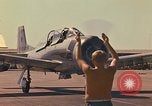 Image of Laotian trainer aircraft T-28D Udorn Royal Thai Air Force Base Thailand, 1972, second 32 stock footage video 65675038807
