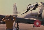 Image of Laotian trainer aircraft T-28D Udorn Royal Thai Air Force Base Thailand, 1972, second 47 stock footage video 65675038807