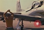 Image of Laotian trainer aircraft T-28D Udorn Royal Thai Air Force Base Thailand, 1972, second 48 stock footage video 65675038807