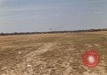 Image of USAF F-4C aircraft landing with drogue chute Ubon Ratchathani Thailand, 1967, second 4 stock footage video 65675038909