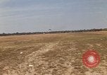 Image of USAF F-4C aircraft landing with drogue chute Ubon Ratchathani Thailand, 1967, second 5 stock footage video 65675038909