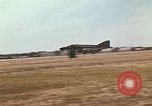 Image of USAF F-4C aircraft landing with drogue chute Ubon Ratchathani Thailand, 1967, second 14 stock footage video 65675038909