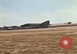 Image of USAF F-4C aircraft landing with drogue chute Ubon Ratchathani Thailand, 1967, second 15 stock footage video 65675038909