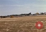 Image of USAF F-4C aircraft landing with drogue chute Ubon Ratchathani Thailand, 1967, second 16 stock footage video 65675038909