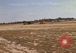 Image of USAF F-4C aircraft landing with drogue chute Ubon Ratchathani Thailand, 1967, second 23 stock footage video 65675038909