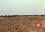 Image of USAF F-4C aircraft landing with drogue chute Ubon Ratchathani Thailand, 1967, second 43 stock footage video 65675038909
