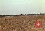 Image of USAF F-4C aircraft landing with drogue chute Ubon Ratchathani Thailand, 1967, second 49 stock footage video 65675038909