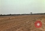 Image of USAF F-4C aircraft landing with drogue chute Ubon Ratchathani Thailand, 1967, second 53 stock footage video 65675038909