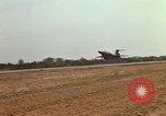 Image of USAF F-4C aircraft landing with drogue chute Ubon Ratchathani Thailand, 1967, second 56 stock footage video 65675038909