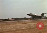 Image of USAF F-4C aircraft landing with drogue chute Ubon Ratchathani Thailand, 1967, second 57 stock footage video 65675038909