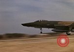 Image of USAF F-4C aircraft landing with drogue chute Ubon Ratchathani Thailand, 1967, second 58 stock footage video 65675038909