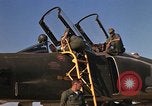 Image of Ground crews meet RF-4C aircraft back from mission Ubon Ratchathani Thailand, 1967, second 19 stock footage video 65675038911
