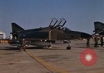 Image of Ground crew with returning RF-4C aircraft Ubon Ratchathani Thailand, 1967, second 3 stock footage video 65675038915