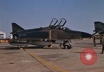 Image of Ground crew with returning RF-4C aircraft Ubon Ratchathani Thailand, 1967, second 8 stock footage video 65675038915