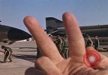 Image of Ground crew with returning RF-4C aircraft Ubon Ratchathani Thailand, 1967, second 48 stock footage video 65675038915