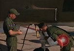 Image of Ground crew with returning RF-4C aircraft Ubon Ratchathani Thailand, 1967, second 49 stock footage video 65675038915